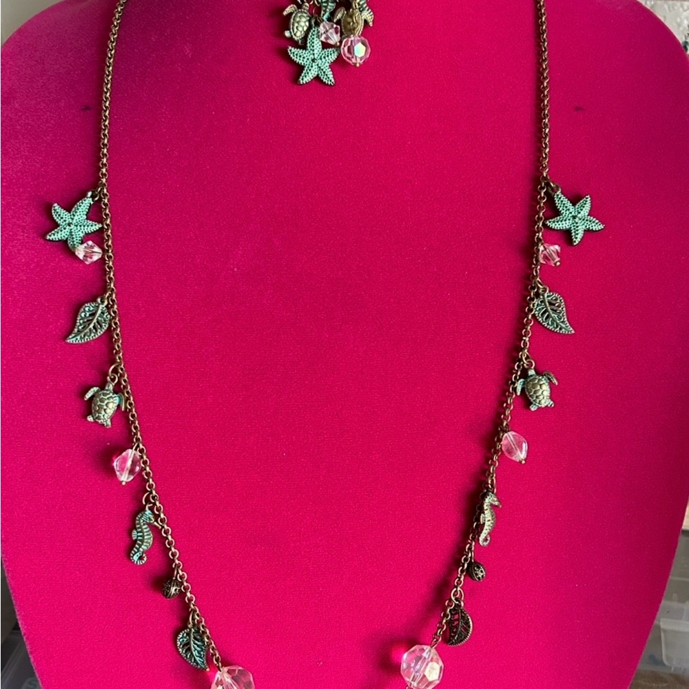 Set of necklaces, earrings, bracelet in old gold and green with sea charms